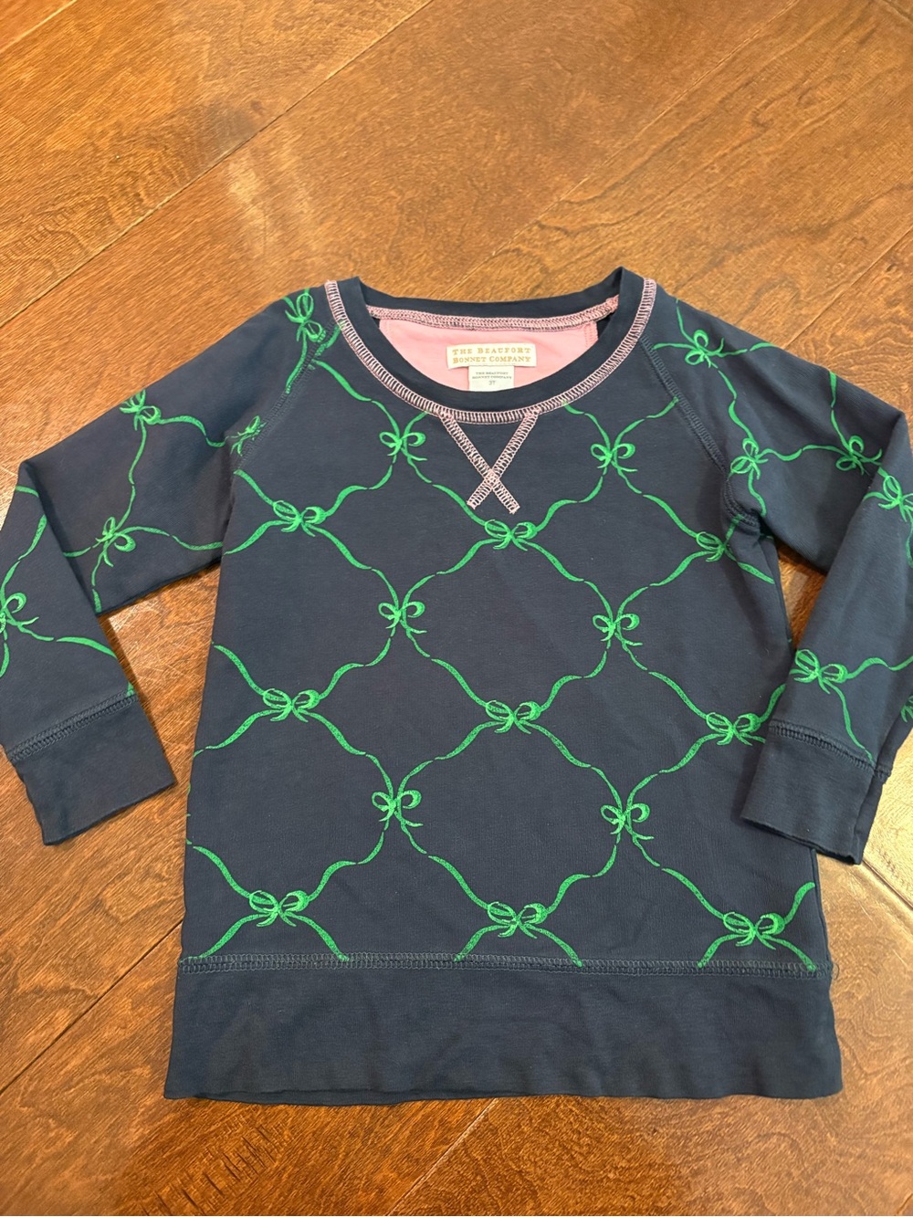 The Beaufort Bonnet Company Navy Sweatshirt with Green Bow Print